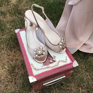 Caparros open toe with sling back.